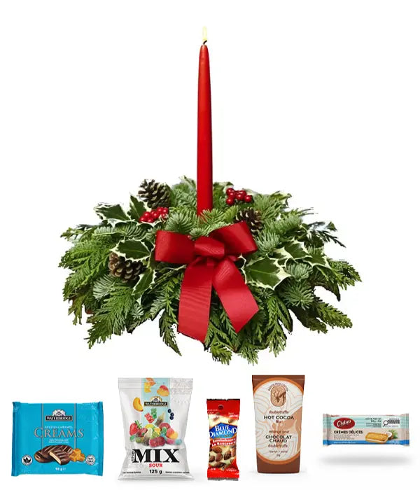 Christmas gourmet centerpiece with candle and treats