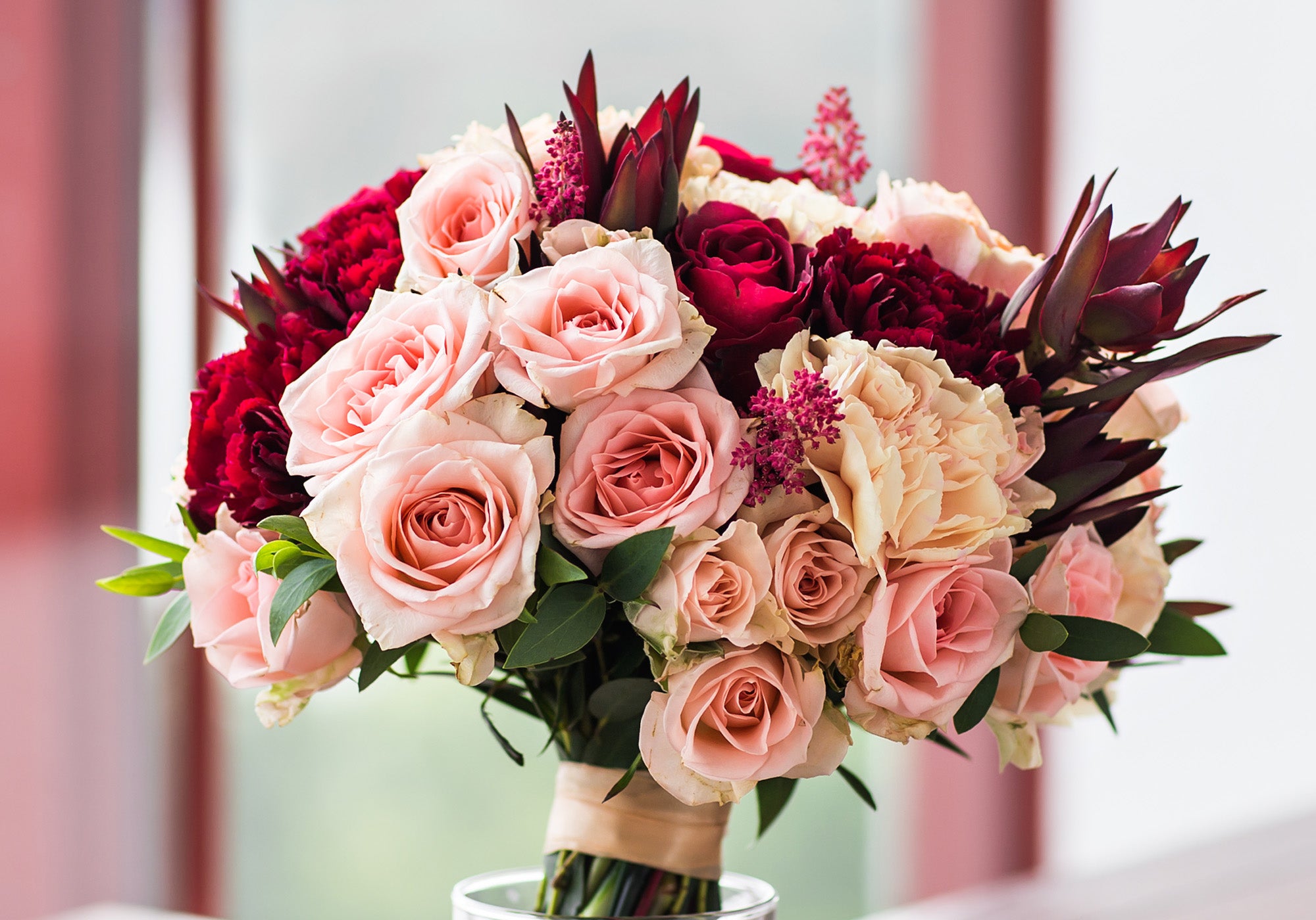 A beautiful bouquet of pink and red roses.