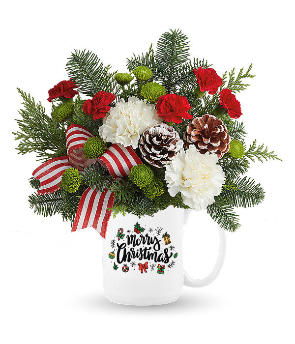 Merry Christmas floral arrangement in mug.
