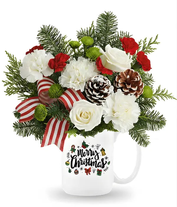 Merry Christmas floral arrangement in mug.