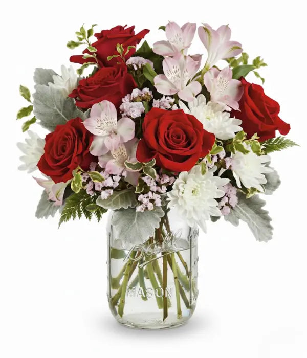 Red roses in mason jar bouquet