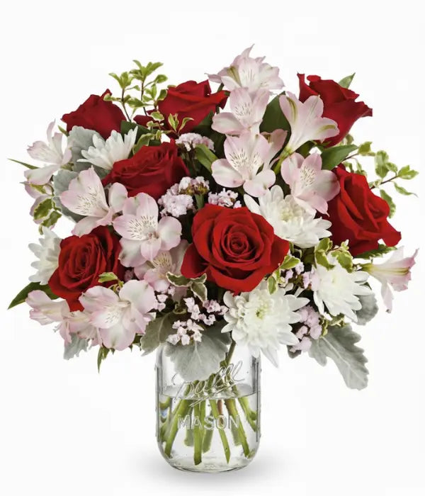 Red roses and flowers in mason jar from florist