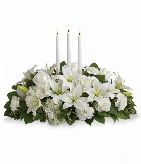 Snowy white centerpiece with candles from Florist