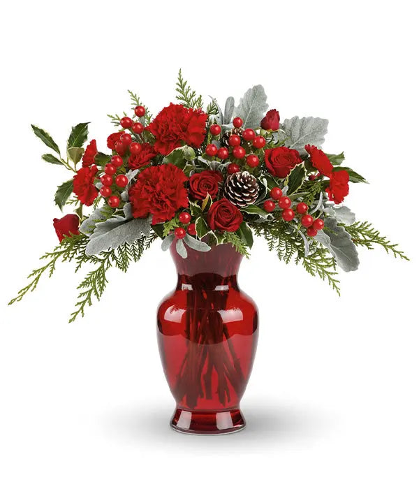 Red roses & carnations in a red vase.