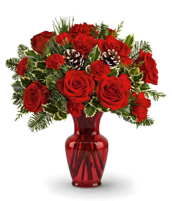 Winter woodland bouquet of red roses, carnations, & pine cones.