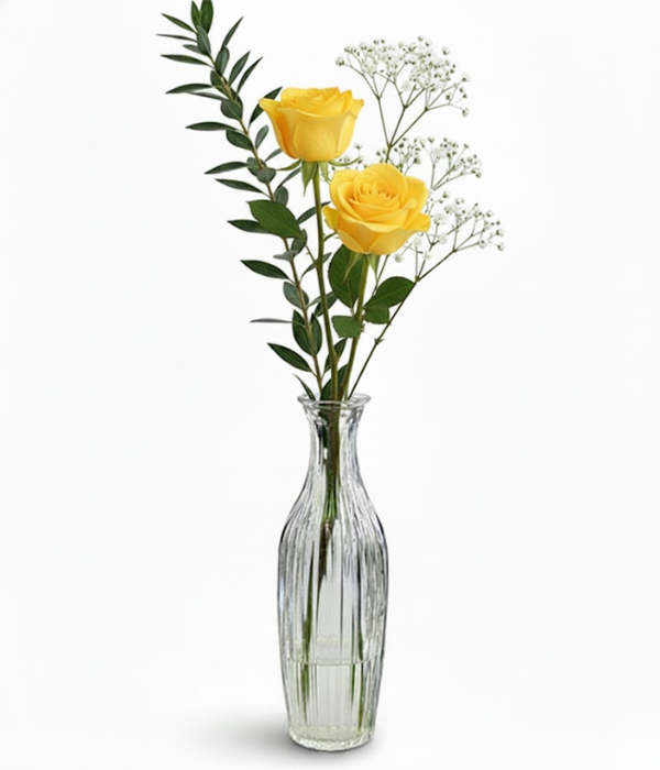 Yellow roses in bud vase from florist