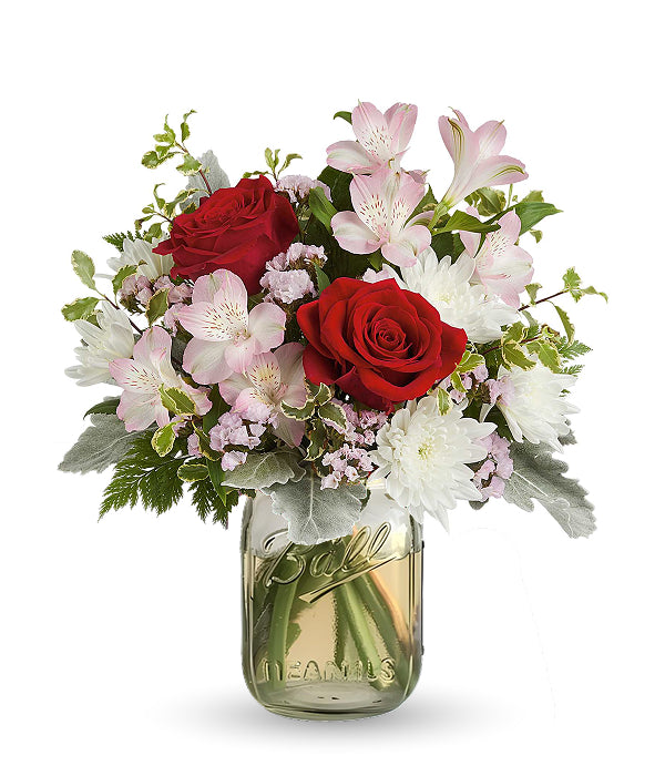Red roses & mixed flowers in a mason jar.